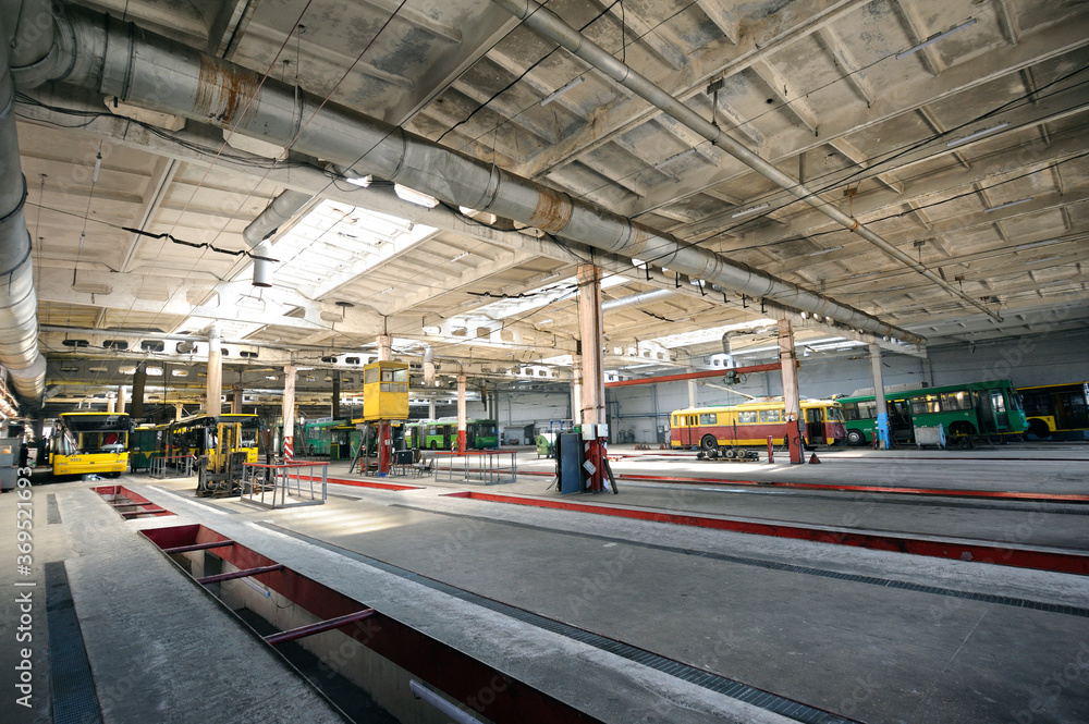 Trolleybuses parked at a trolley depot hangar for technical inspection, depot maintenance Trolleybuses parked at a trolley depot hangar for technical inspection, depot maintenance