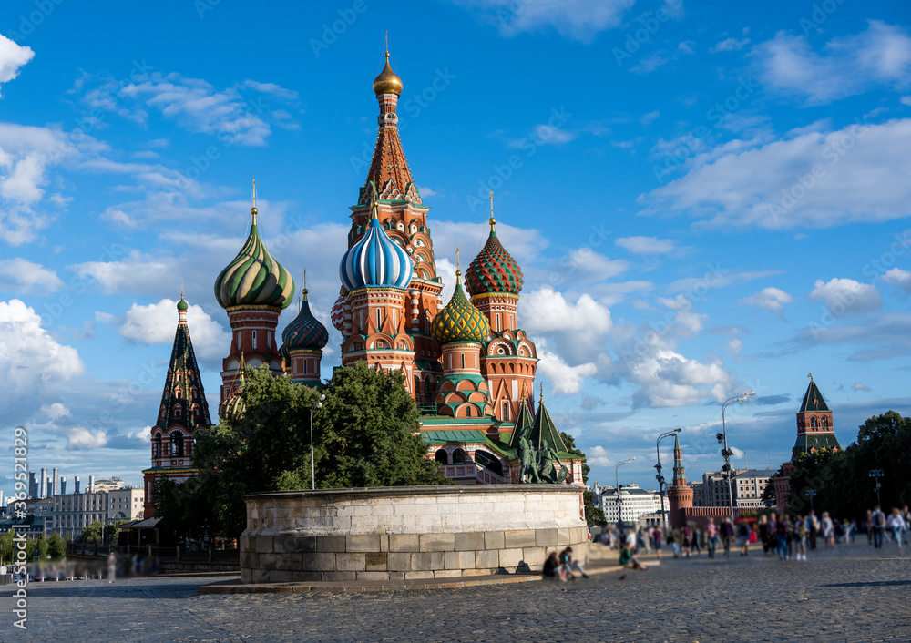 Fototapeta premium city view of the old kremlin on a beautiful temple and a large square against the sky with clouds