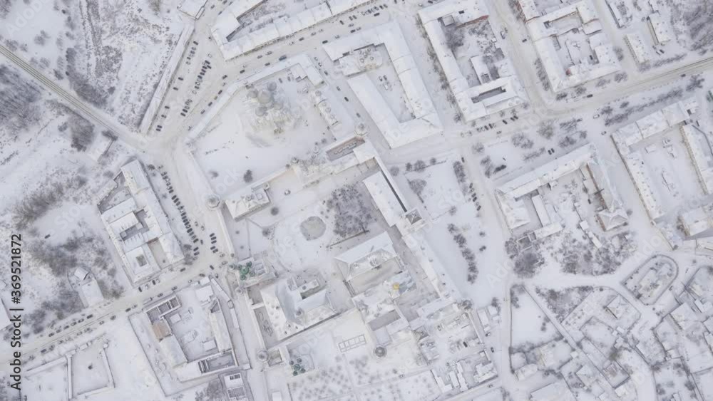 90 degrees rotating aerial shot of a provincial town in snow 90 degrees rotating aerial shot of a provincial town in snow