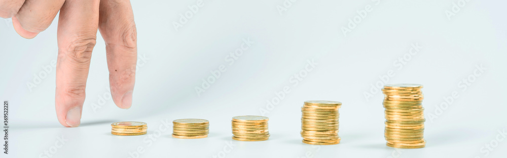 web banner business and finance investment and saving activity with gold coin arrange on white isolated with finger acting background web banner business and finance investment and saving activity with gold coin arrange on white isolated with finger acting background
