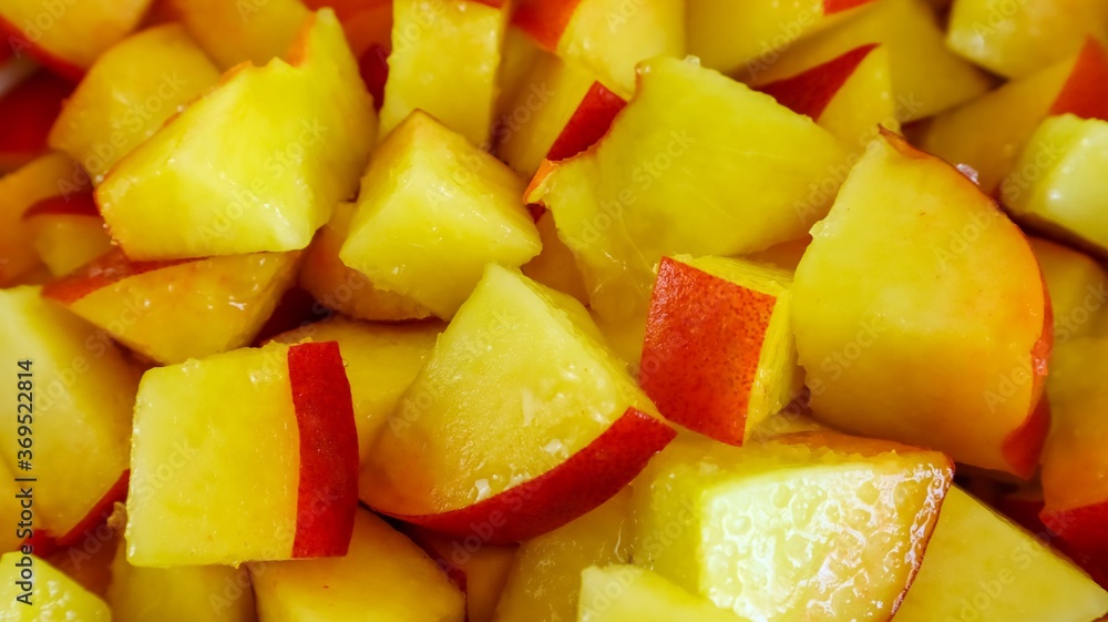 Background texture bright yellow cut fruit peach close-up Background texture bright yellow cut fruit peach close-up