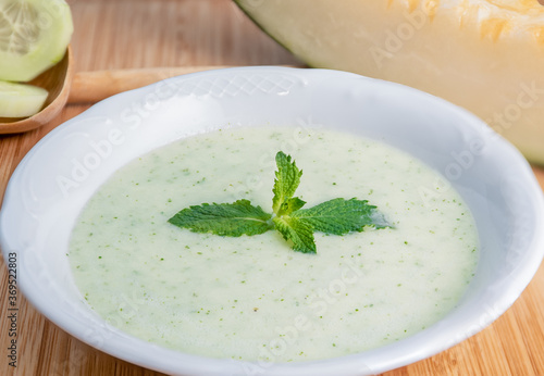 Melon soup with cucumber and mint.