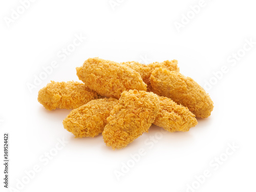 Fried crispy chicken nuggets on white background