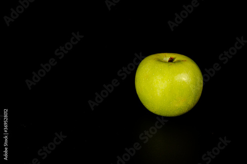 green apple on black
