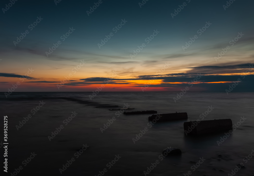 Old concrete pier at sea