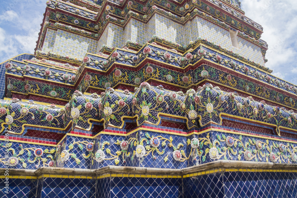 Closeup of mosaic pattern detail of a buddhist temple in Wat Pho complex in the Phra Nakhon district in Bangkok, Thailand