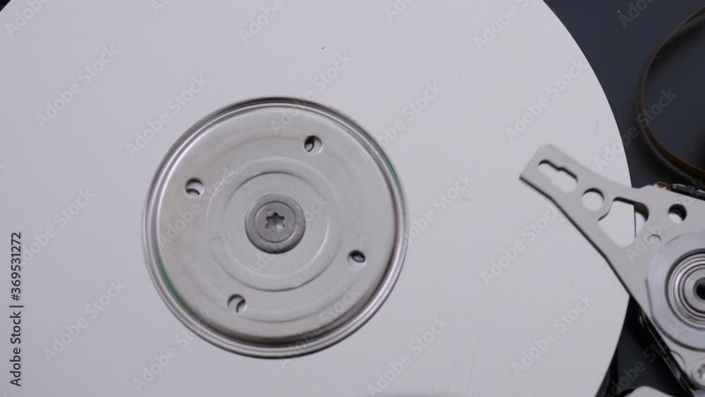 Hard disk detail with reading head trying to recover lost data database Hard disk detail with reading head trying to recover lost data database