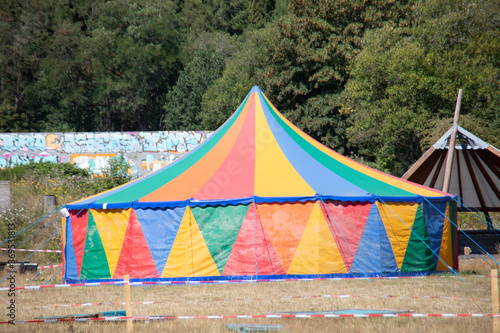 colorful circus tent in the park with tension cables
