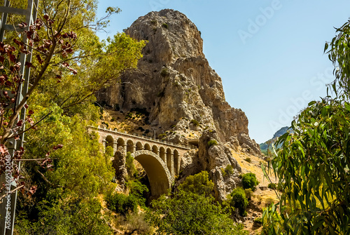 A view of the railway bridge close to the entrance to the Gaitanejo river gorge near Ardales, Spain in the summertime