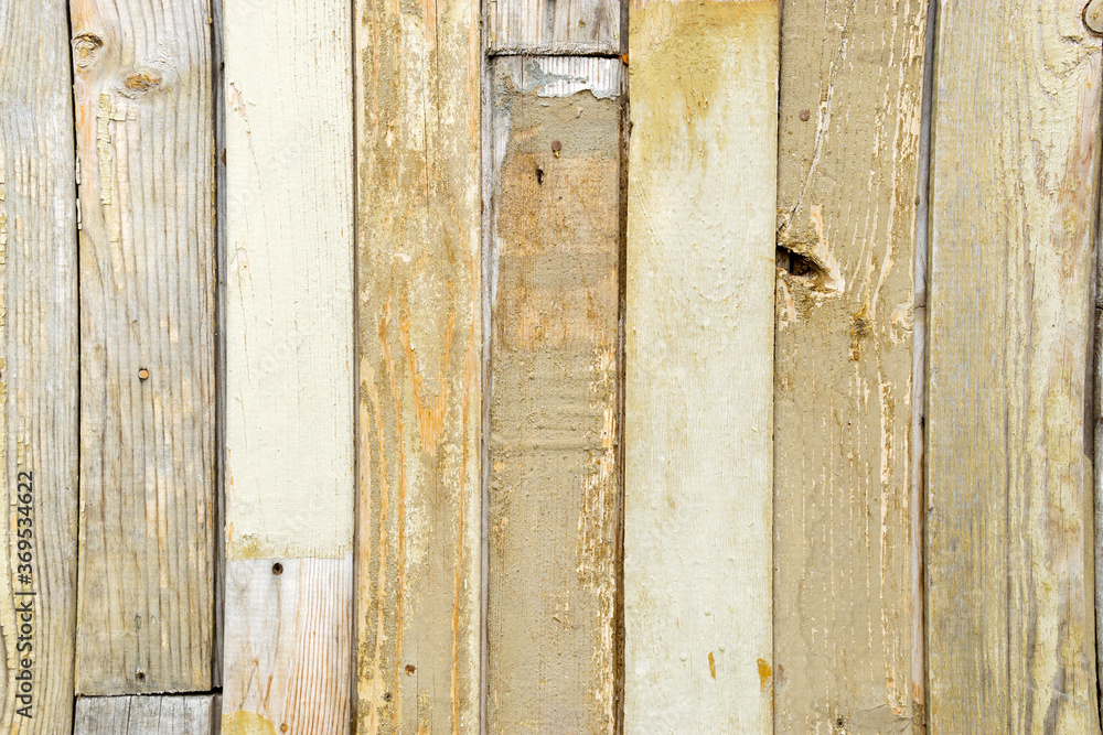 old retro texture of wooden yellow fence old paint with nails. background old retro texture of wooden yellow fence old paint with nails. background