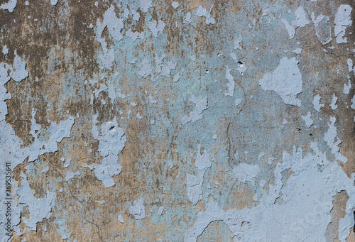 Blue, beige old wall with peeled plaster