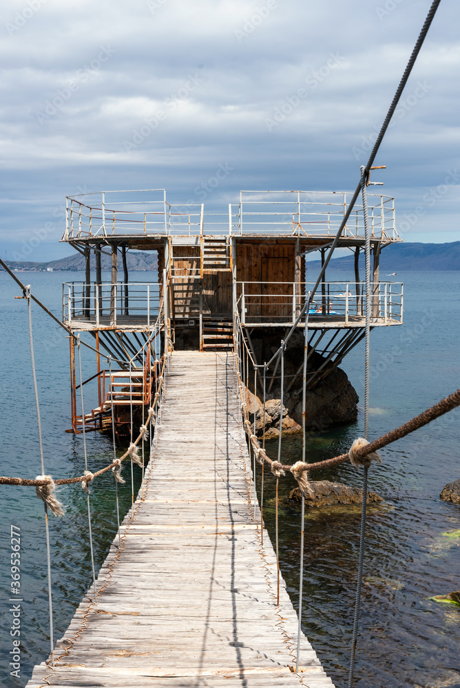 Fototapeta premium Abandoned rusty pier on the sea
