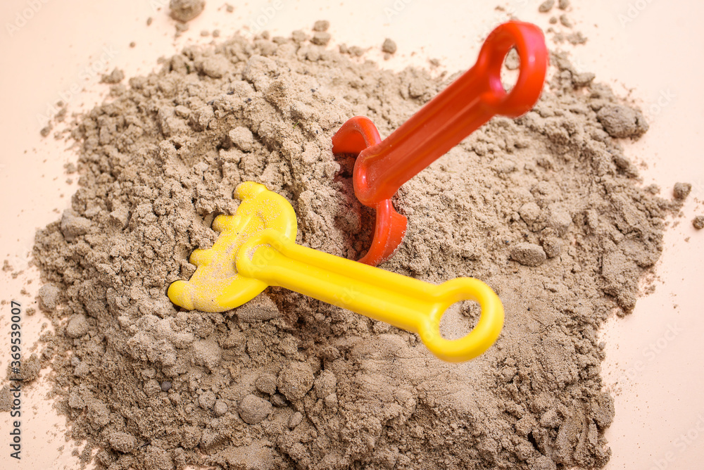 Beach sand with toys for the baby, water, the word summer in colored letters. Staycation content Beach sand with toys for the baby, water, the word summer in colored letters. Staycation content