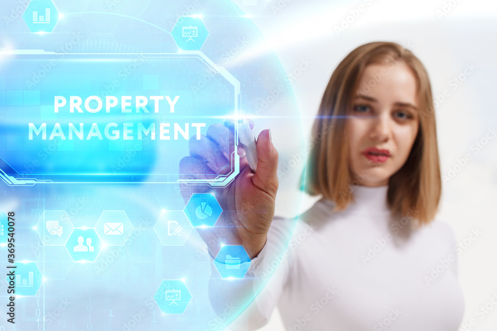 Business, Technology, Internet and network concept. Young businessman working on a virtual screen of the future and sees the inscription: Property management Business, Technology, Internet and network concept. Young businessman working on a virtual screen of the future and sees the inscription: Property management