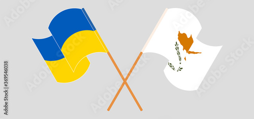 Crossed and waving flags of Cyprus and the Ukraine