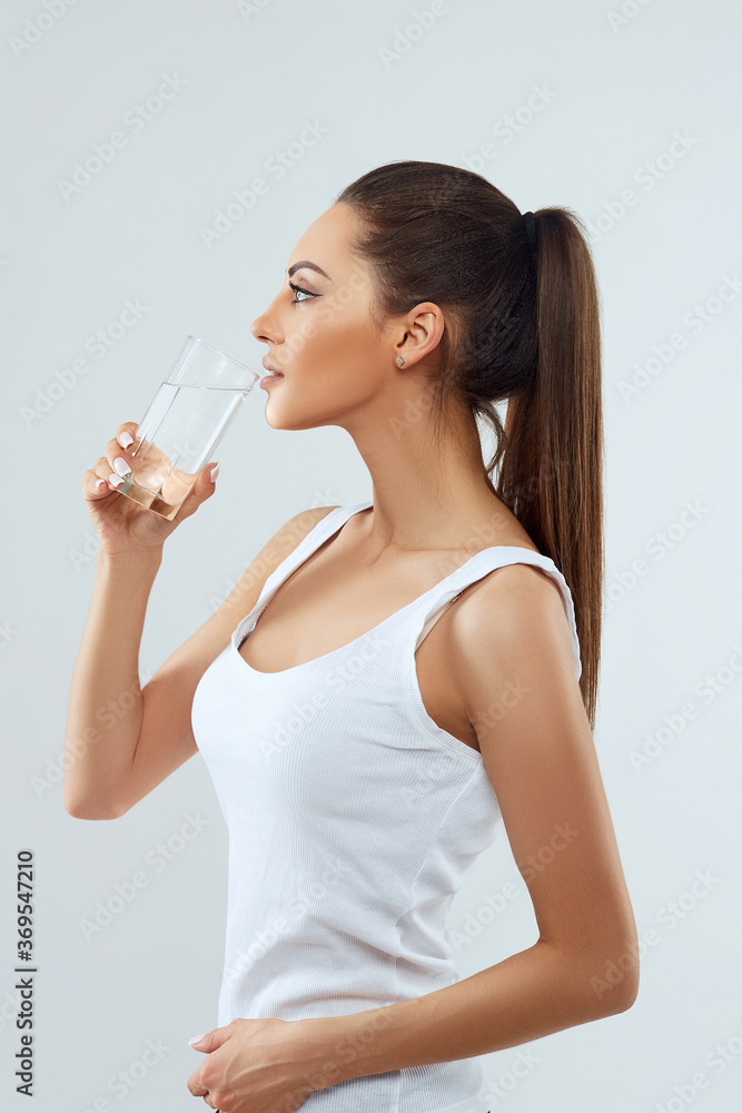 Drink Water.Pоrtrait Of Beautiful Healthy Girl With Beauty Face Drinking Fresh Water In Morning.Young Woman With Glass Of Water. Diet Concept Drink Water.Pоrtrait Of Beautiful Healthy Girl With Beauty Face Drinking Fresh Water In Morning.Young Woman With Glass Of Water. Diet Concept