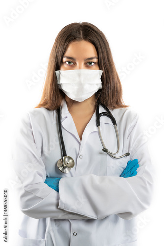 Confident doctor in protective wear and face mask wearing gloves