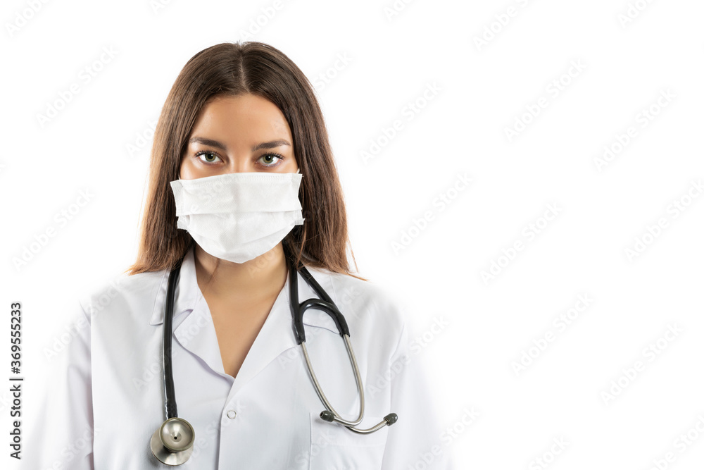 Confident doctor in protective wear and face mask wearing gloves Confident doctor in protective wear and face mask wearing gloves