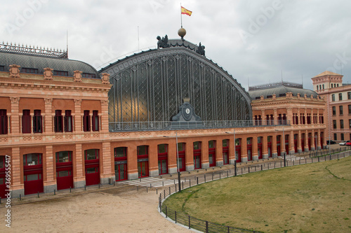 Editorial. Coronavirus pandemic. Empty city. Empty Atocha railway station building facade in Madrid, Spain.