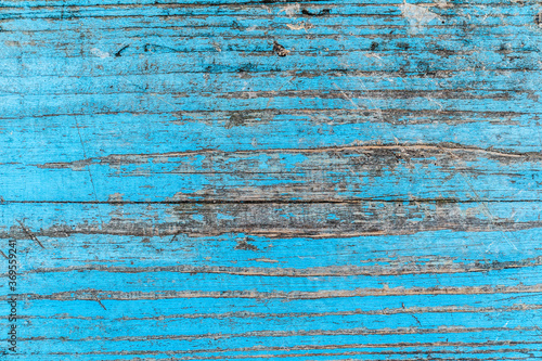 Texture of an old blue wooden board. Rough surface. Background