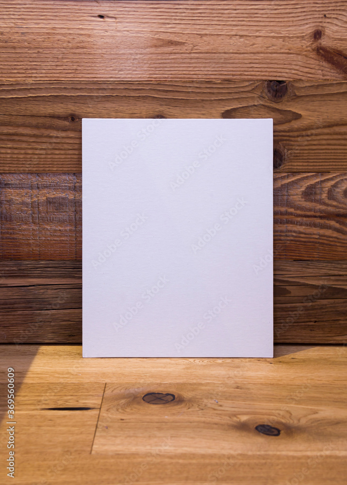 White frame on wooden wall background, mock up White frame on wooden wall background, mock up