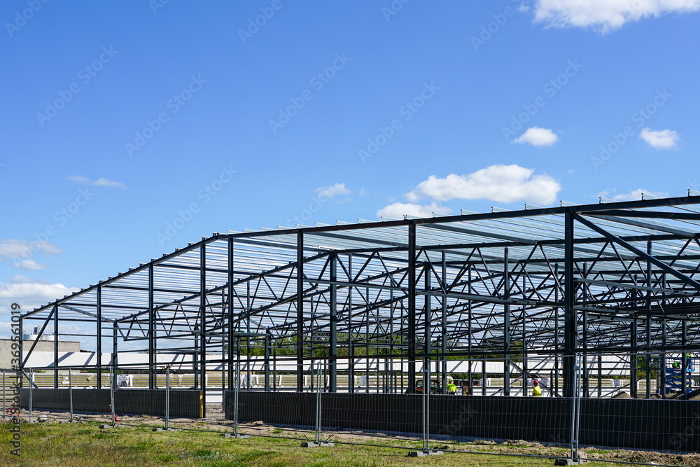 construction of a new modern industrial building, metal truss frame