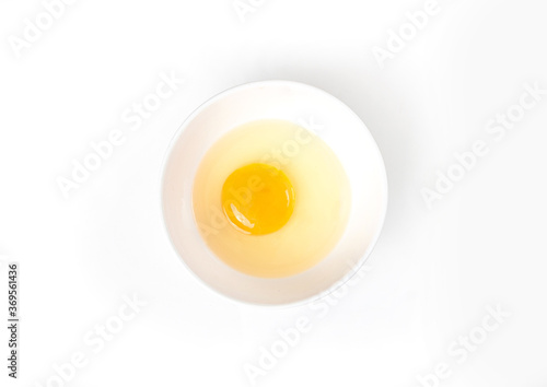 Raw egg bowl on white background