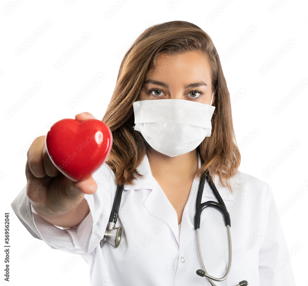 Confident doctor in protective wear and face mask wearing gloves Confident doctor in protective wear and face mask wearing gloves