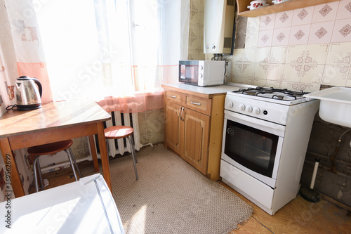 General view of an old kitchen unit in the interior of a kitchen in need of repair