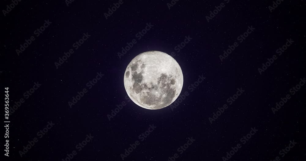 Moon in the space with stars moving around. Animated full moon bright. Moon in the space with stars moving around. Animated full moon bright.