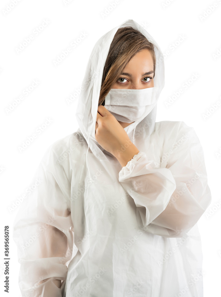 Confident doctor in protective wear and face mask wearing gloves Confident doctor in protective wear and face mask wearing gloves