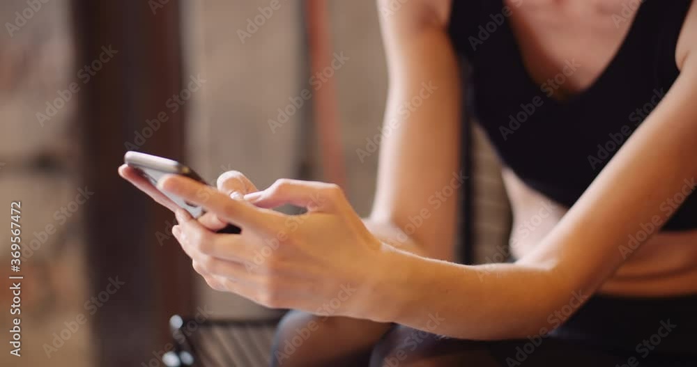 Fit Young Woman Using Smartphone In Gym Fit Young Woman Using Smartphone In Gym
