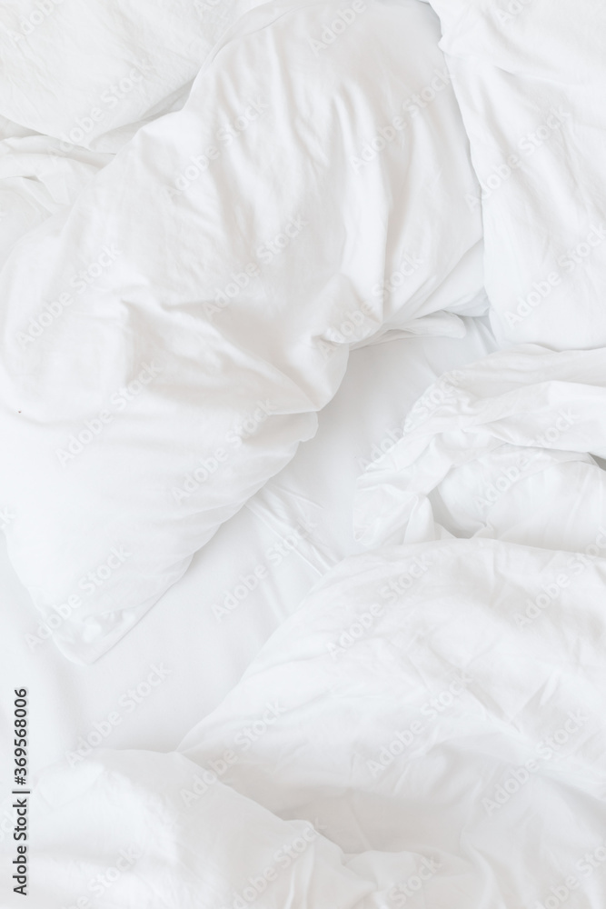white pillows on a bed white pillows on a bed