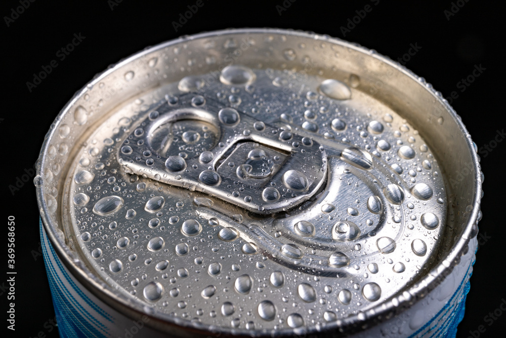 Wet pin on the can. A refreshing drink closed in a metal container. Wet pin on the can. A refreshing drink closed in a metal container.