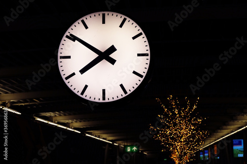 White clock without digits in some Airport or Railway station. Time no time concept
