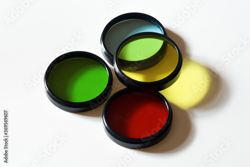 Stack of old photographic glass color filters isolated