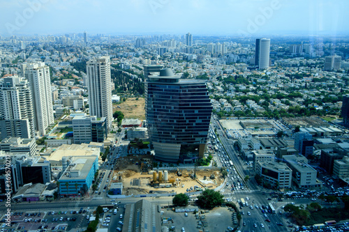 Aerial view of Tel Aviv s skyline with urban skyscrapers and blue sky  horizontal image. Israel.