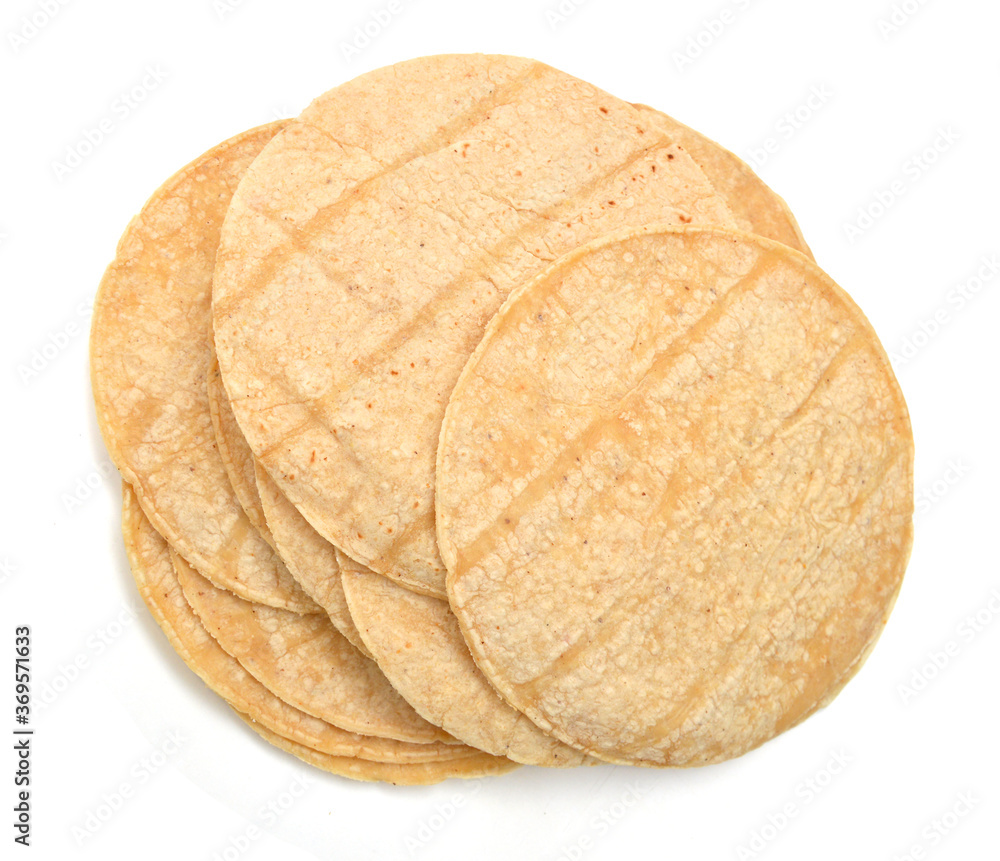 A stack of corn tortillas on a white background A stack of corn tortillas on a white background