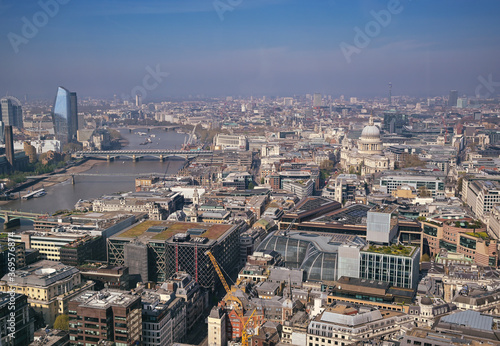 An aerial view of London, UK along the River Thames.