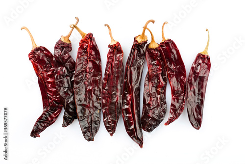 Bild auf Leinwand Dried Mexican red hot Chile Guajillo chili offered as close-up on white backgrou