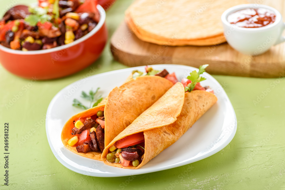 Tacos - delicious tortillas with meat and vegetables Tacos - delicious tortillas with meat and vegetables