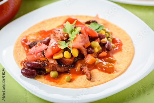 Tacos - delicious tortillas with meat and vegetables