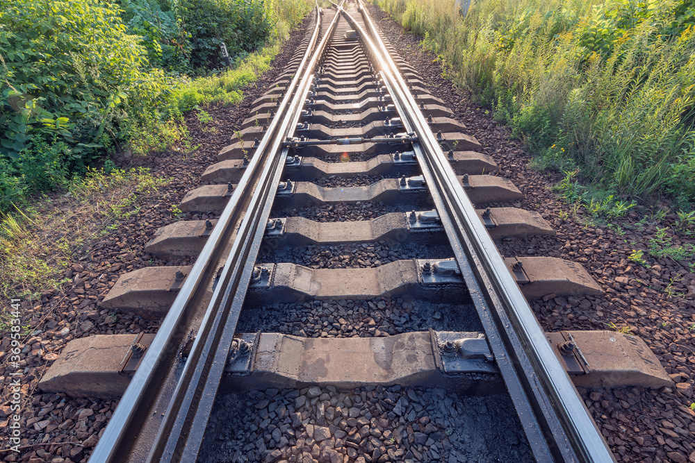 Railway tracks on the station at evening time. Railway tracks on the station at evening time.
