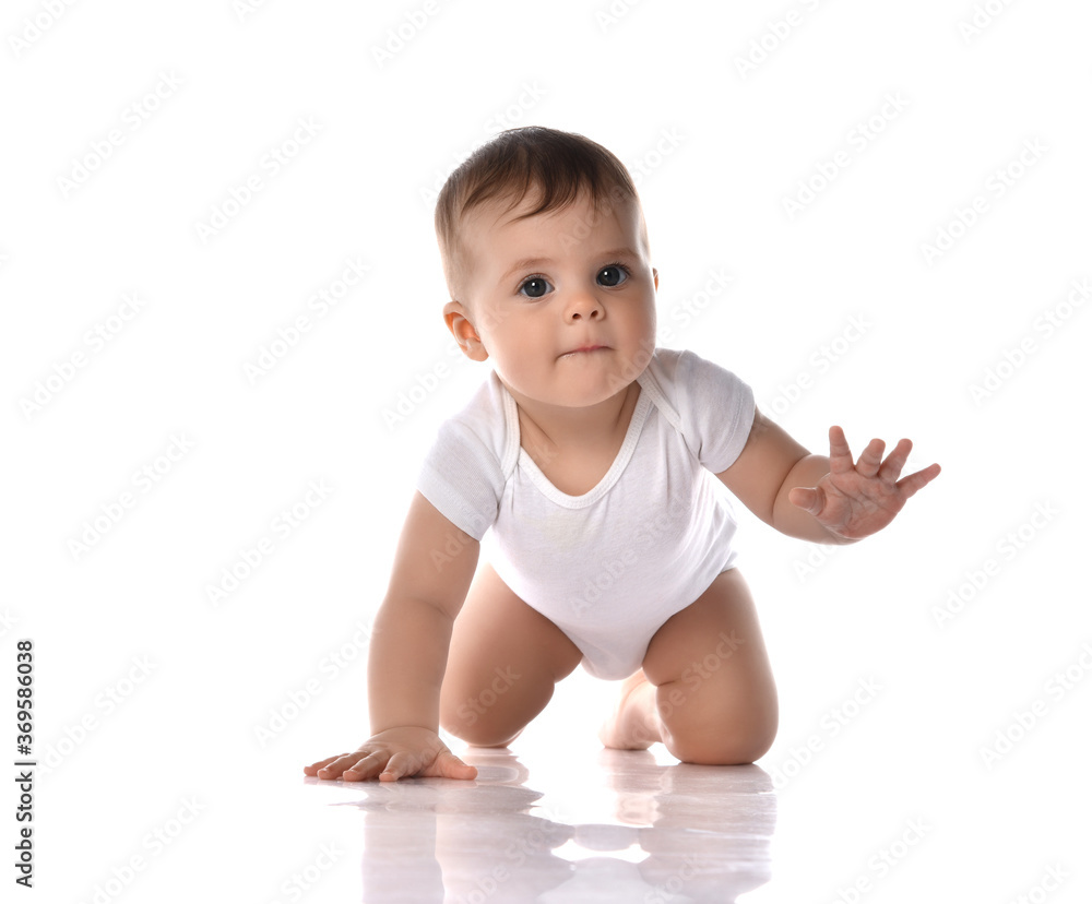 Portrait of sweet cute baby boy toddler in white body crawling on ...
