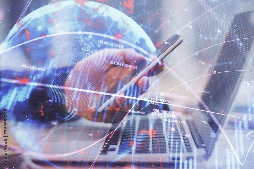Double exposure of man's hands holding and using a phone and financial graph drawing. Analysis concept. Double exposure of man's hands holding and using a phone and financial graph drawing. Analysis concept.