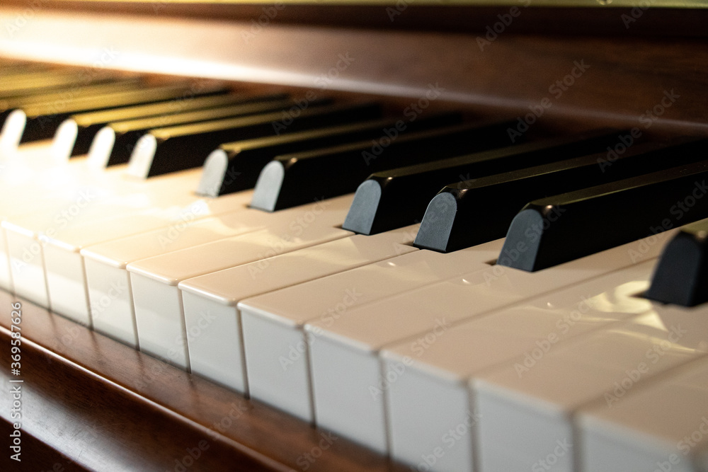 side angle of sunlight hitting piano keys side angle of sunlight hitting piano keys