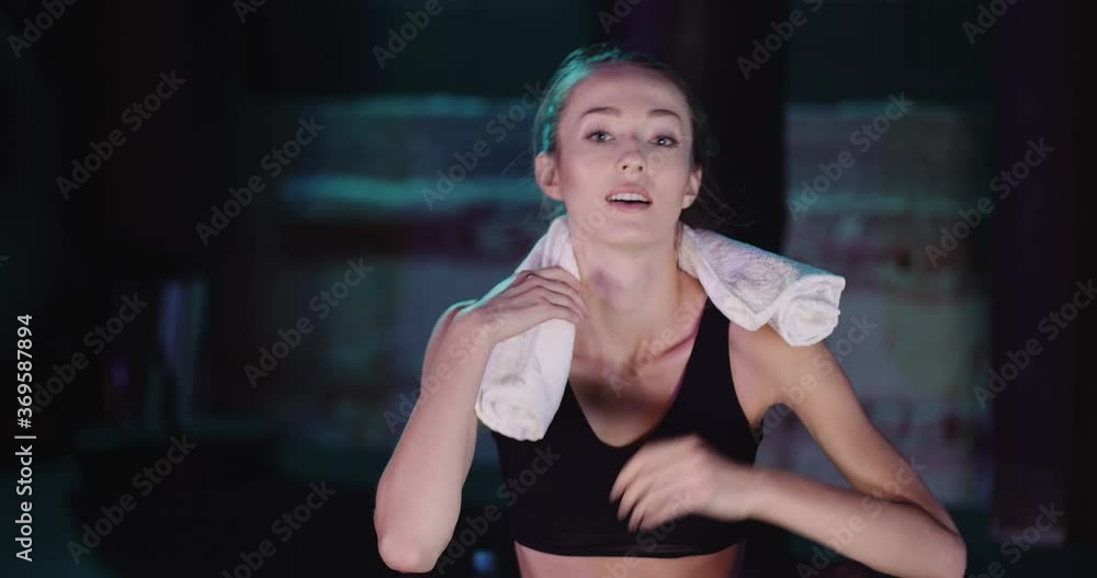 Woman Resting After Exercising In Fitness Studio Woman Resting After Exercising In Fitness Studio