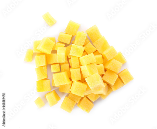 Raw yellow carrot cubes isolated on white, top view