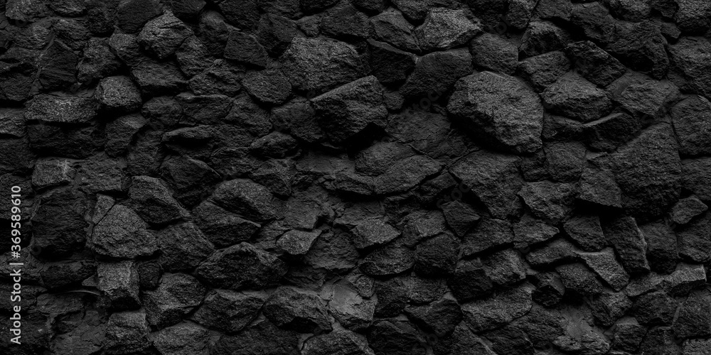 Long black stone texture and textured background.