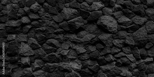 Long black stone texture and textured background.